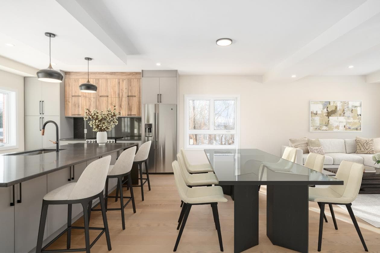 Open-plan grey and walnut kitchen with peninsula and integrated dining